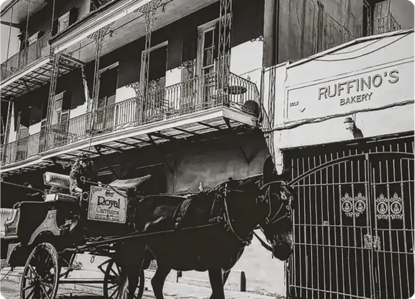 Horse-drawn carriage outside Ruffino's Bakery.